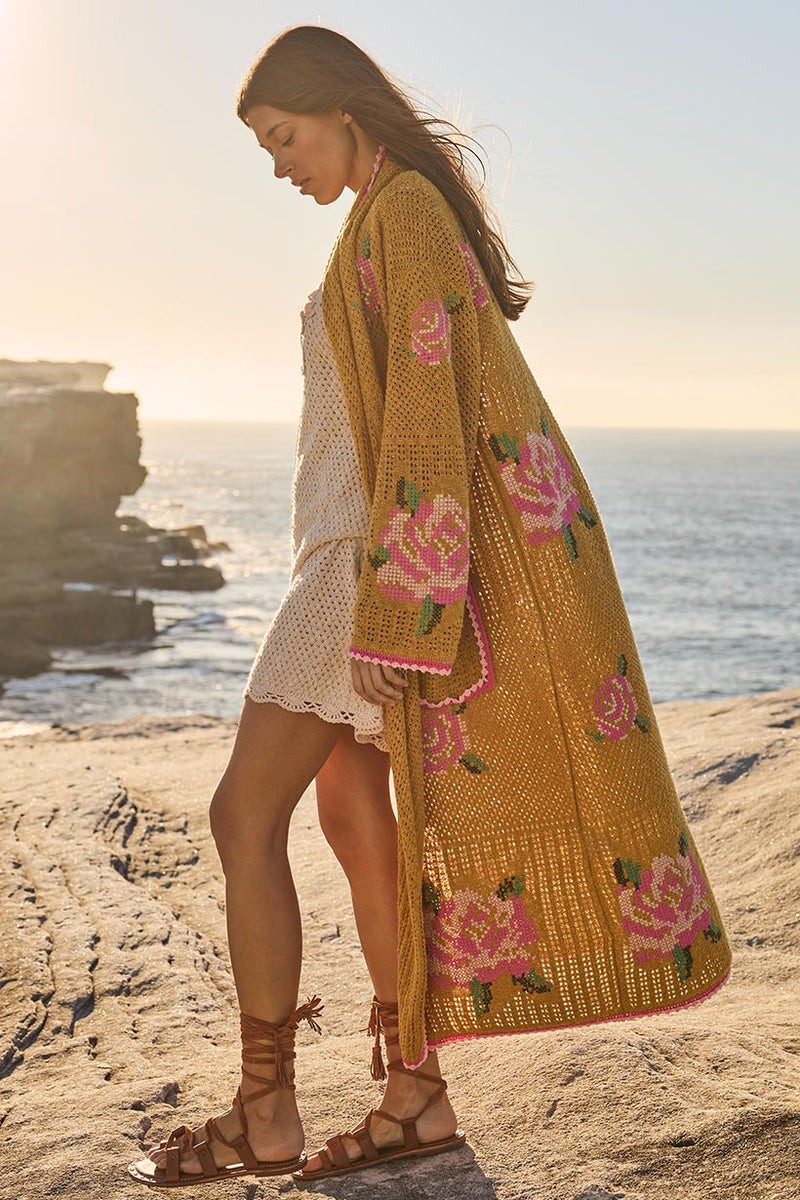 Woman in a floral kimono standing on a beach with ocean view
Coastal Granny Maxi Cardigan