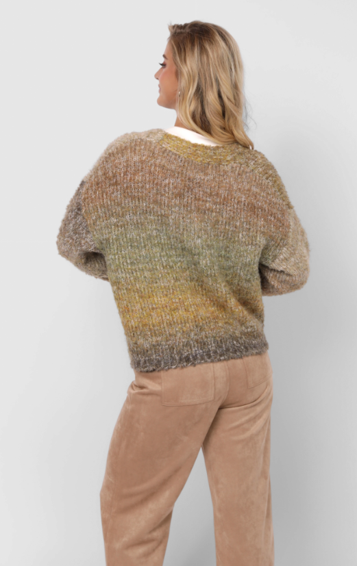 Woman wearing a multicoloured cardigan over a white shirt with beige pants on a plain background
Smiley Ombre Knit Cardigan