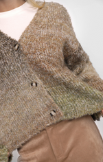 Close-up of a textured multicoloured sweater with buttons on a plain background
Smiley Ombre Knit Cardigan