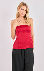 Woman wearing a red strapless top and black pants on a white background
Romy Satin Tube Top
