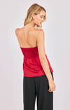 Woman wearing a strapless red top and black pants on a light gray background
Romy Satin Tube Top