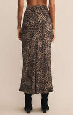 Person wearing a leopard print skirt on a beige background
Izabel Leopard Skirt