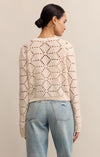 Woman wearing a beige patterned sweater and light blue jeans against a beige background
Rosalyn Cardigan Sweater